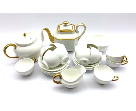 Aynsley part tea set in white with gilt handles comprising twelve cups and saucers, tea pot and stand, milk jug and sugar bow