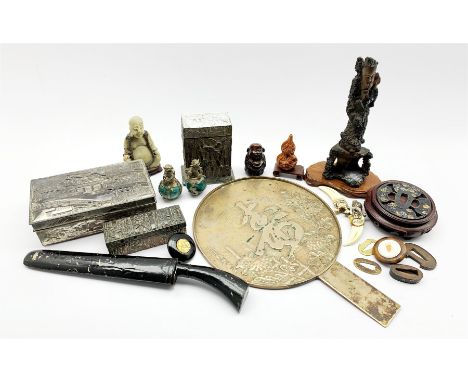 Japanese bronzed hand mirror, Japanese Tsuba mounted on hardwood stand, a Japanese netsuke, Japanese metal guards, a knife in