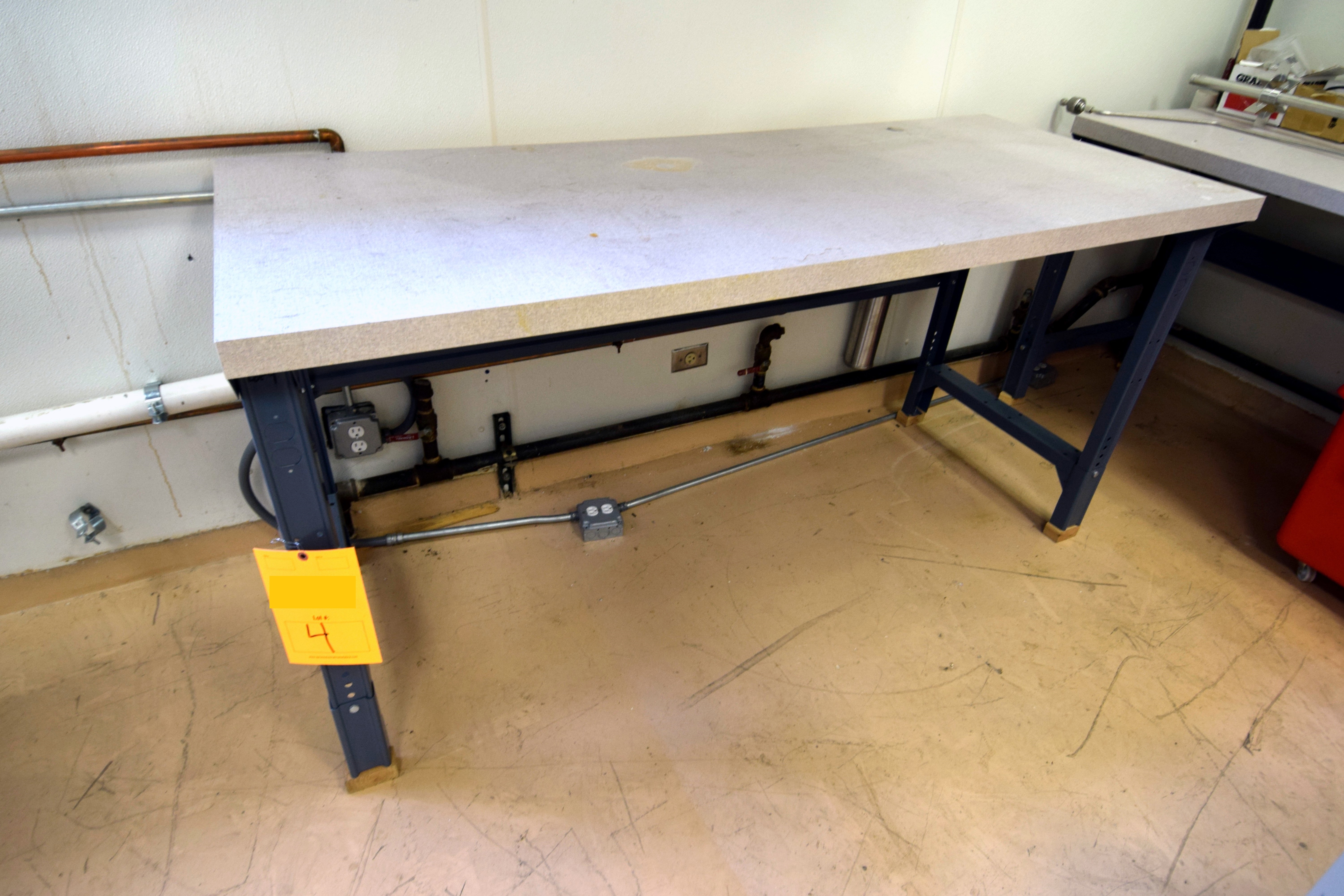 Formica top work table, approximate 72" long x 30" deep. With metal legs.