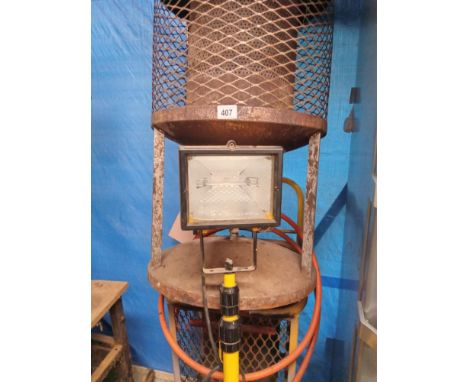 2 gas work shop heaters and a work lamp on stand.