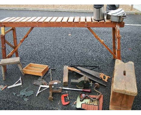 A wooden shelf/stand, wooden stools, tools etc.,