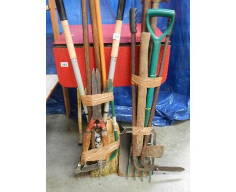 2 good bundles of garden tools.