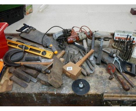 A mixed lot of tools including hammers, saws, 2 electric drills, grind stones and a good selection of drill bits.
