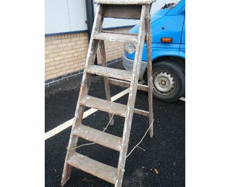 A old wooden 6 tread step ladder.