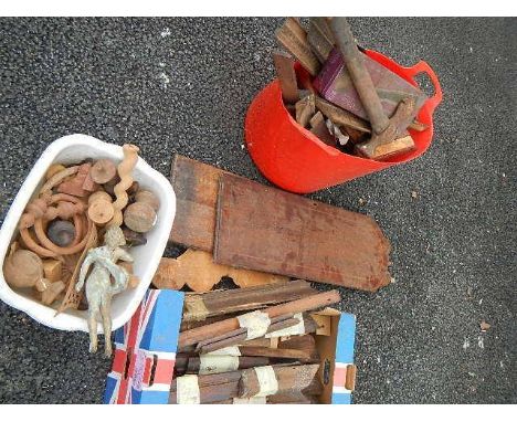 A mixed lot of wood turnings, beading, 2 clock doors, tools etc.,