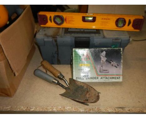 Various assorted gardening and DIY tools.