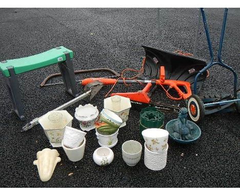A good lot of garden tools including electric hoe, chain saw, snow scoop etc.,