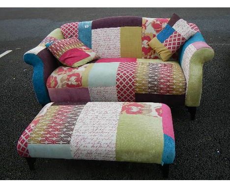 A good quality multi coloured fabric sofa with matching foot stool. ****Condition report**** In good condition for age