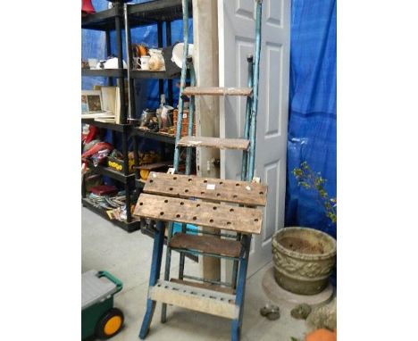 A folding work bench and a 5 tread step ladder.