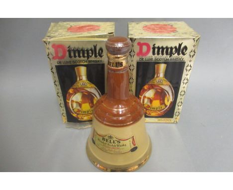 Two boxed bottles of Dimple de luxe scotch whisky, together with a Bell's whisky decanter (3)Condition good