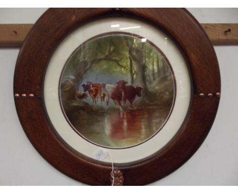 Round framed ceramic plaque, Cattle scene. Signed J A Philips