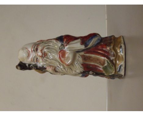 Oriental ceramic god figure