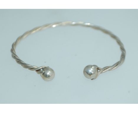 A 925 silver rope twist bangle bracelet with ball finials. Weight 10.5g