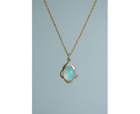 A yellow metal pendant necklace set with opal style stone with round claw clasp. Measures 18 inches. Total weight 4.2g  