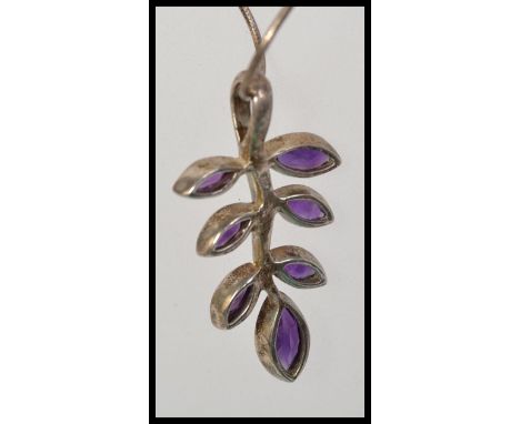 A 925 silver snake chain strung with a 925 silver Art Nouveau leaf pendant set with purple faceted gem stones. 16 inches. Wei