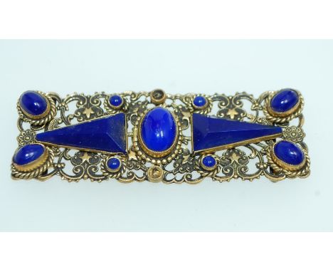 A 1930s Bohemian yellow metal filigree cloak clip clasp set with opaque blue glass carbochons geometric shapes. Possibly Neig