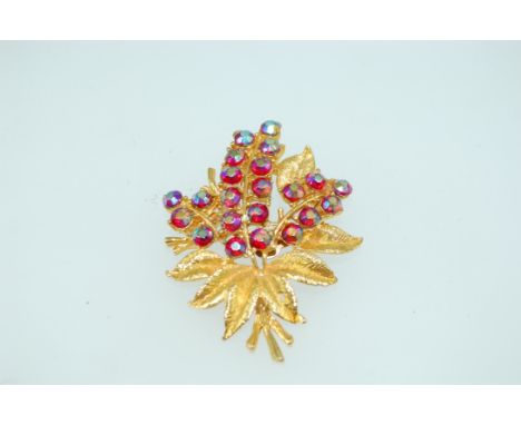 A good quality vintage yellow metal brooch spray brooch with pink Aurora Borealis rhinestones, mark indistinct possibly Trifa