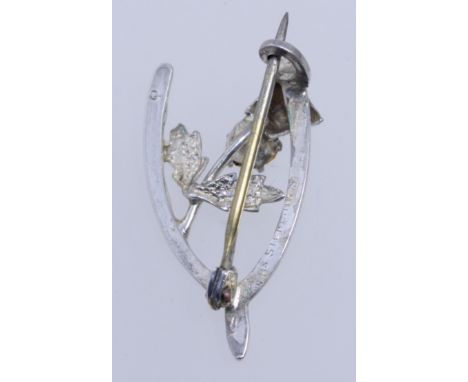 A vintage scottish silver wishbone brooch with thistle set with a yellow paste stone marked WBs Sterling Silver with c clasp.