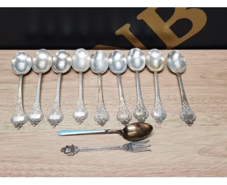 NINE GEORGE V SILVER COFFEE SPOONS BY WAKELY AND WHEELER LONDON 1913 A SILVER GILT AND ENAMEL COFFEE SPOON AND A PICKLE FORK 
