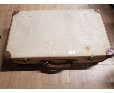 A CANVAS AND LEATHER BOUND VINTAGE SUITCASE WITH MILITARY ARROW MARK TO INTERIOR 72CM