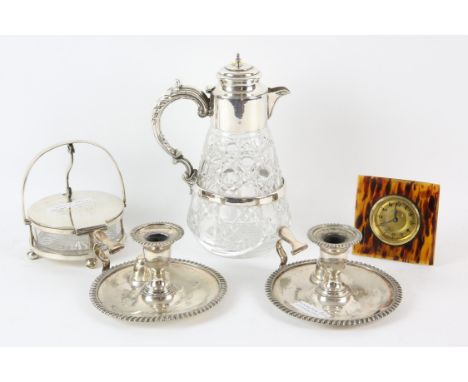 Silver plated and glass butter dish, claret jug, pair of chamber sticks and a faux tortoiseshell bedside clock