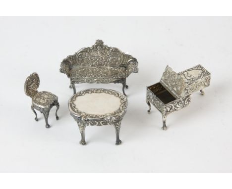 Miniature embossed silver piano with hinged covers, Birmingham 1901, 5cm x 2.5cm x 2.5cm, London 1974, miniature table London