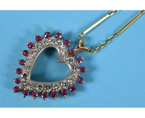 A yellow gold, ruby and diamond heart shaped pendant, on a chain See illustration 