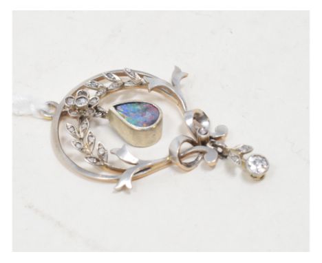 An Edwardian pendant, set diamonds, an opal, within a shaped frame and applied a ribbon tie 