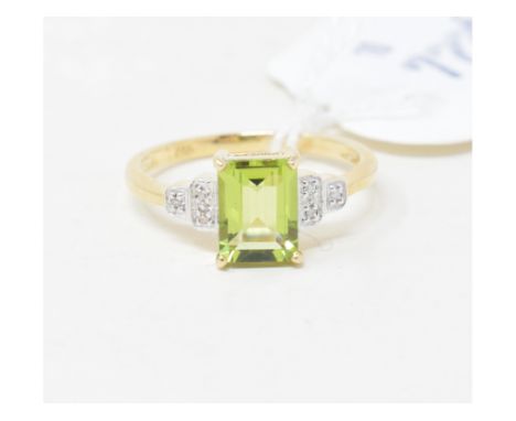 A 9ct gold, peridot and diamond shoulder ring 