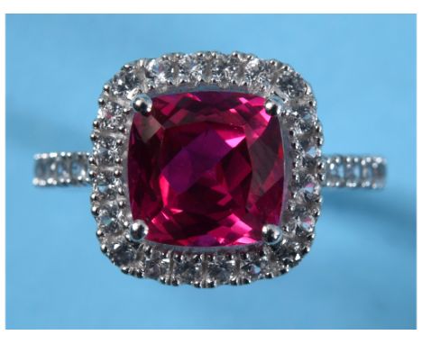 A 14ct white gold, ruby and diamond cluster ring, approx. ring size N½ See illustrationReport by GHApprox. size of main stone