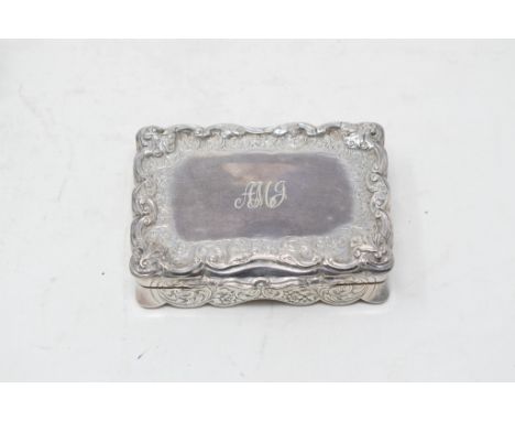 An early Victorian silver snuff box, engraved scrolling acanthus leaves, the top with modern initials, and the underside of t
