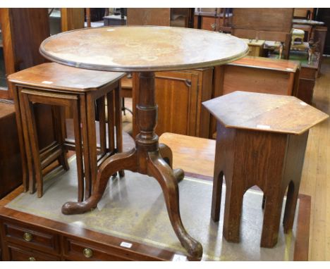 A Liberty style hexagonal oak occasional table, 38 cm wide, a mahogany tripod occasional table and a nest of three tables (3)