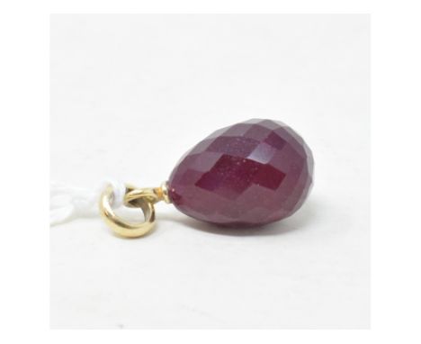 A ruby pendant, of ovoid form, with a yellow gold mount, apparently unmarked 