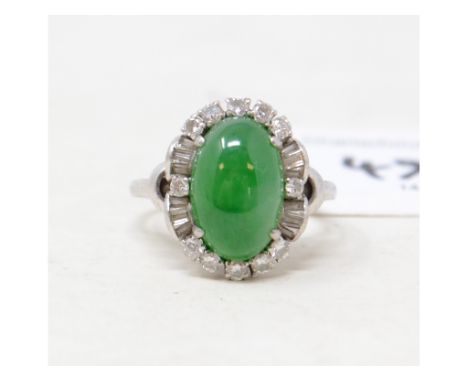 EXTRA LOT:  A platinum, jade and twelve stone diamond ringReport by GHGross weight approx. 7.2 g.Marks indistinct but starts 