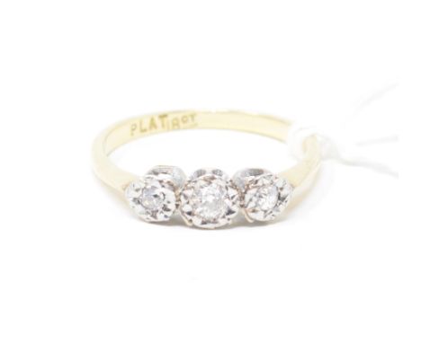 An 18ct gold and platinum three stone diamond ring, approx. ring size K½Approx. 2.1 g 