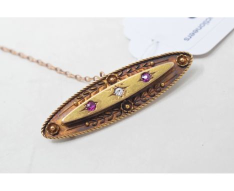 A 15ct gold, ruby and diamond brooch, of navette form 