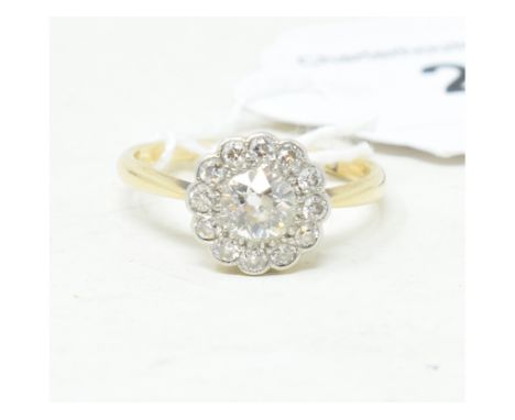 An 18ct gold and diamond flowerhead cluster ring, approx. ring size NReport by GHGross weight approx. 3 g.Hallmark numerals 1