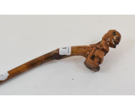 A European (possibly German) folk art walking cane, the handle in the form of a medival man in costume with a ponytail, 101 c