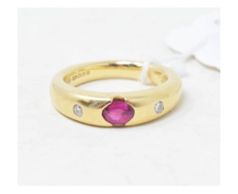 An 18ct gold band ring, set a ruby and two diamonds, approx. ring size LReport by RBApprox. 9.7 g 