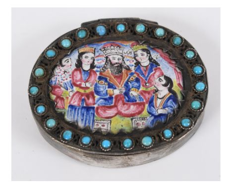 An oval silver coloured metal filigree box, the cover inset an oval enamel panel within a surround of turquoise, 6.5 cm wide 