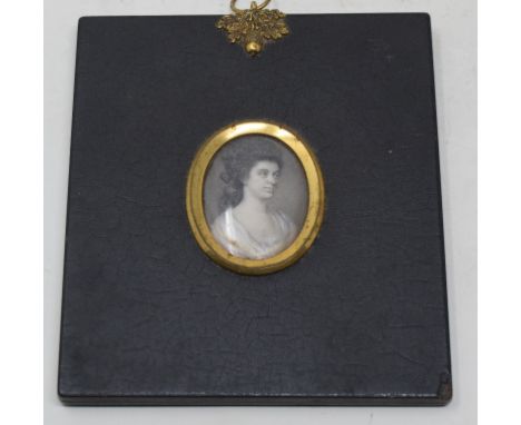 A head and shoulders portrait miniature, of a lady wearing a white shawl, watercolour, 3.5 x 2.5 cm, with a locket of hair ve
