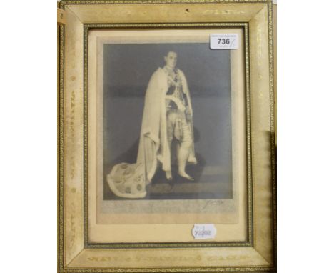 A full length monochrome photographic portrait, of a gentleman of stature, indistinctly signed and dated 1937, in a gilt tool