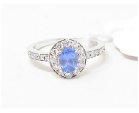 A white coloured metal, sapphire and diamond cluster ring, unmarked, approx. ring size K½ 