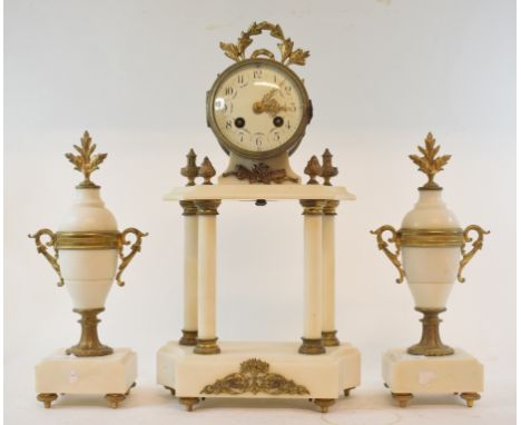 A late 19th century French clock garniture, the clock having an 8.5 cm diameter enamel dial with Arabic numerals and floral s