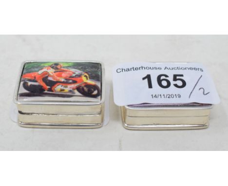 Two silver and enamel pill boxes, decorated motorbikes 