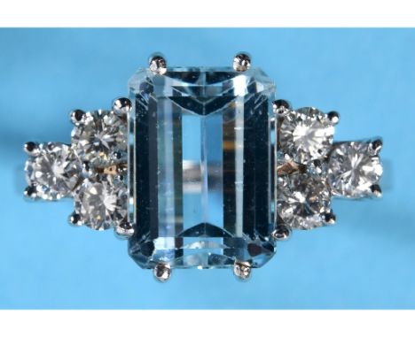 An Art Deco style 18ct white gold ring, set an aquamarine within a surround of six diamonds, approx. ring size M See illustra