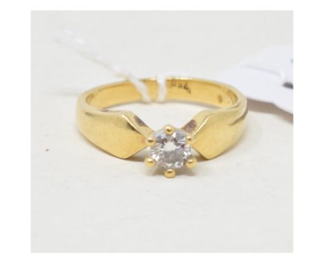 An 18ct gold solitaire diamond ring, approx. ring size M½Report by RBApprox. 4.6 g (all in) 