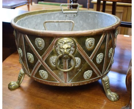 A copper and brass log bin, on hairy paw feet, 48 cm wide, a fire screen, a standard lamp, a sutherland table, a bureau and o