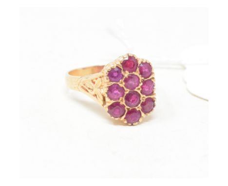 An 18ct gold and ruby cluster ring, approx. ring size L 