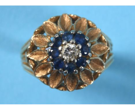 A 14ct gold, sapphire and diamond ring, in the form of a flowerhead surrounded by petals, approx. ring size M See illustratio